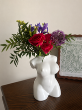 Daisy Blue Home Fragrance Olive Vase with a sleek ceramic design and olive green finish on a wooden surface.