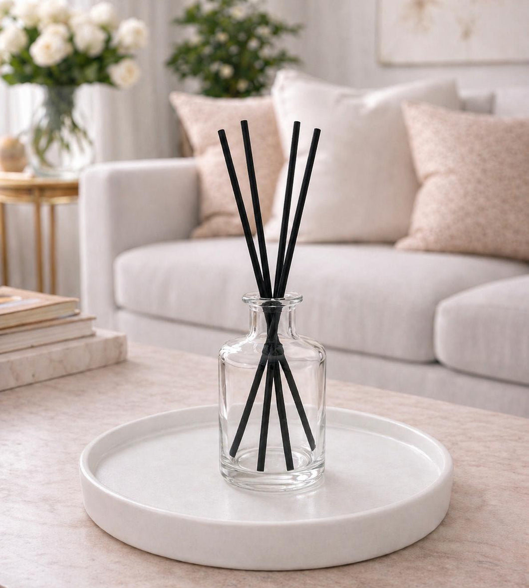 Daisy Blue Home Fragrance Mirelle reed diffuser bottle with elegant glass design and natural reed sticks for home scenting